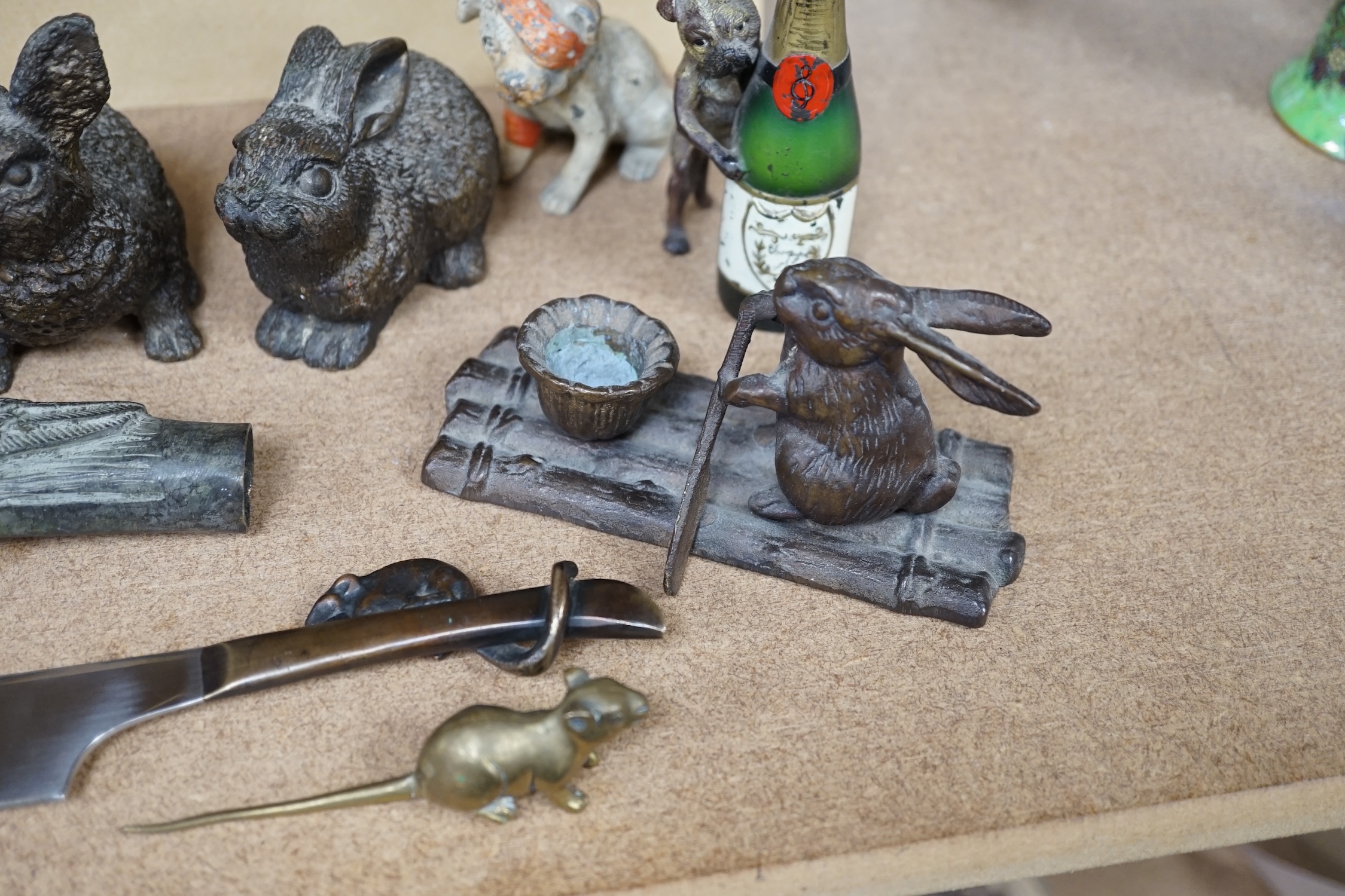 A collection of mixed metal novelty animal ornaments, walking stick handles, etc. of mice, dogs and rabbits, largest 13cm high (9). Condition - fair